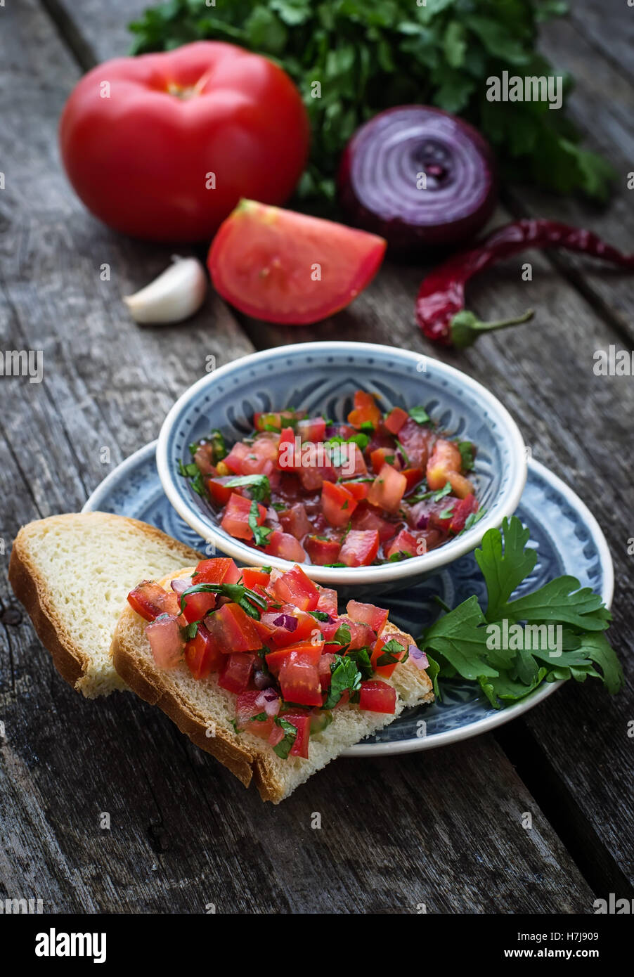 Mexican  tomato salsa sauce and toasts. Selective focus Stock Photo