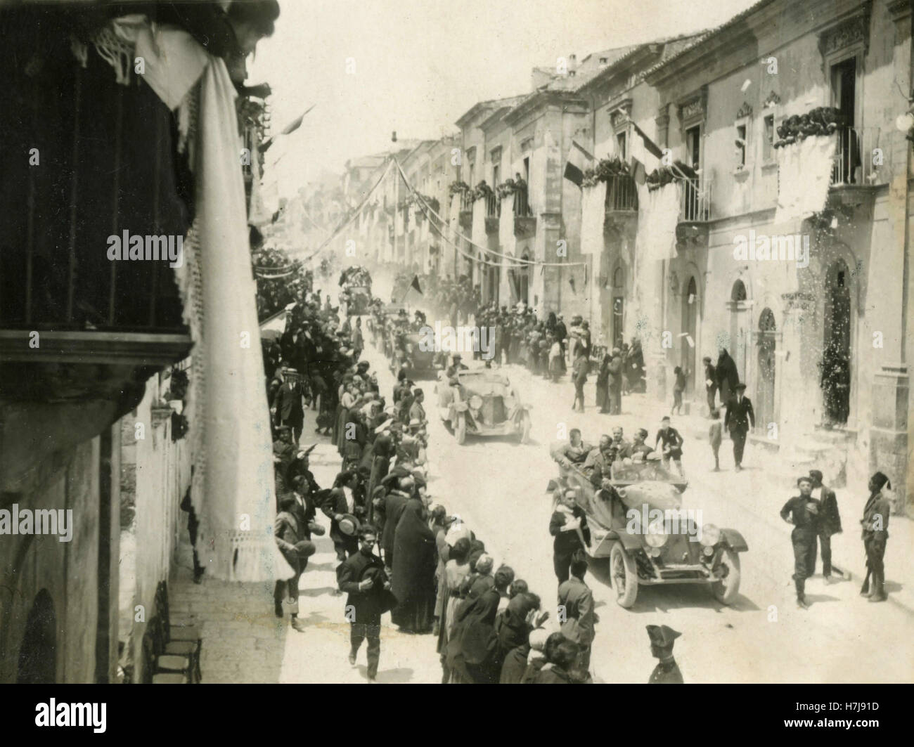 Cars parading through the main street, Italy Stock Photo