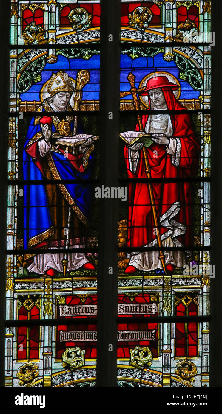 Stained Glass window depicting Saints Augustine and Jerome or Hieronymus, in the Cathedral of Mechelen, Belgium. Stock Photo