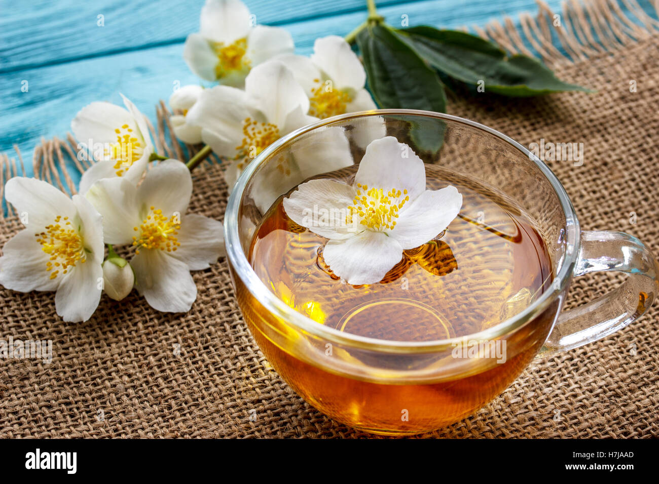 jasmine tea and jasmine flowers on  wooden background Stock Photo