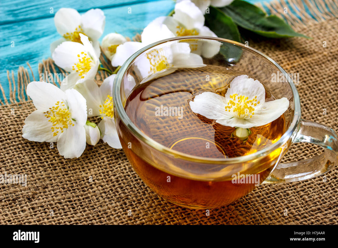 jasmine tea and jasmine flowers on  wooden background Stock Photo
