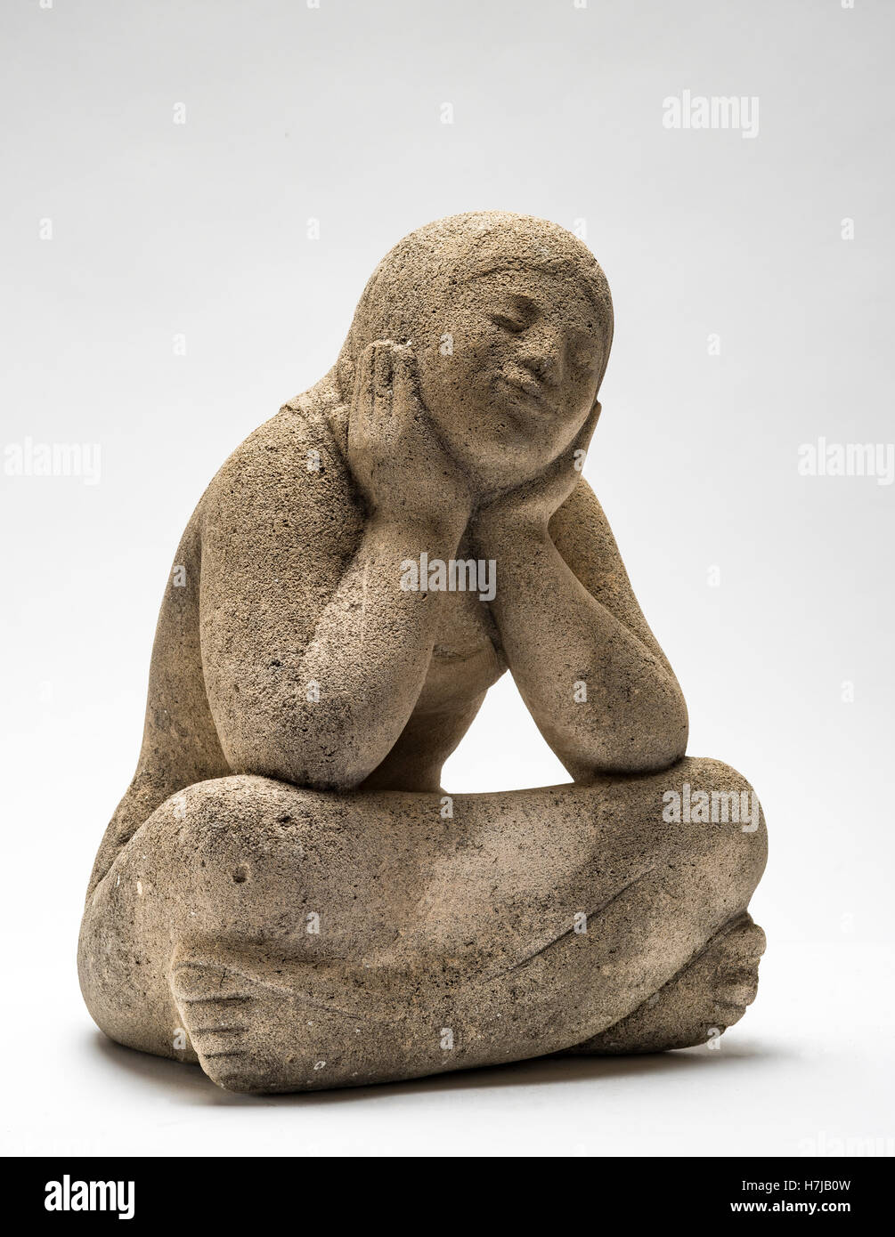 Contemplative young girl, stone sculpture by French sculptor Jean Henninger Stock Photo