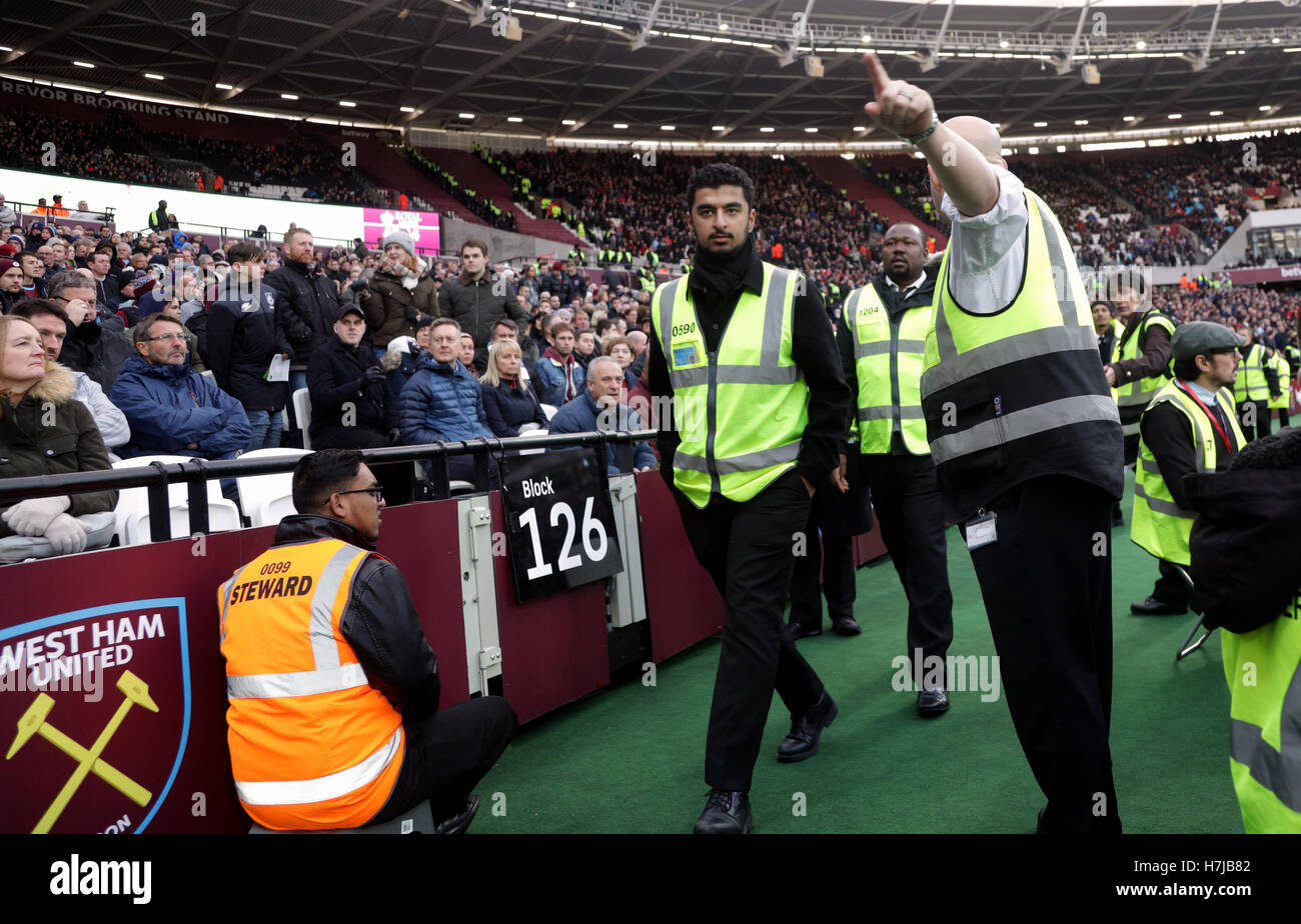 Stewards pitch side during the Premier League match at London Stadium
