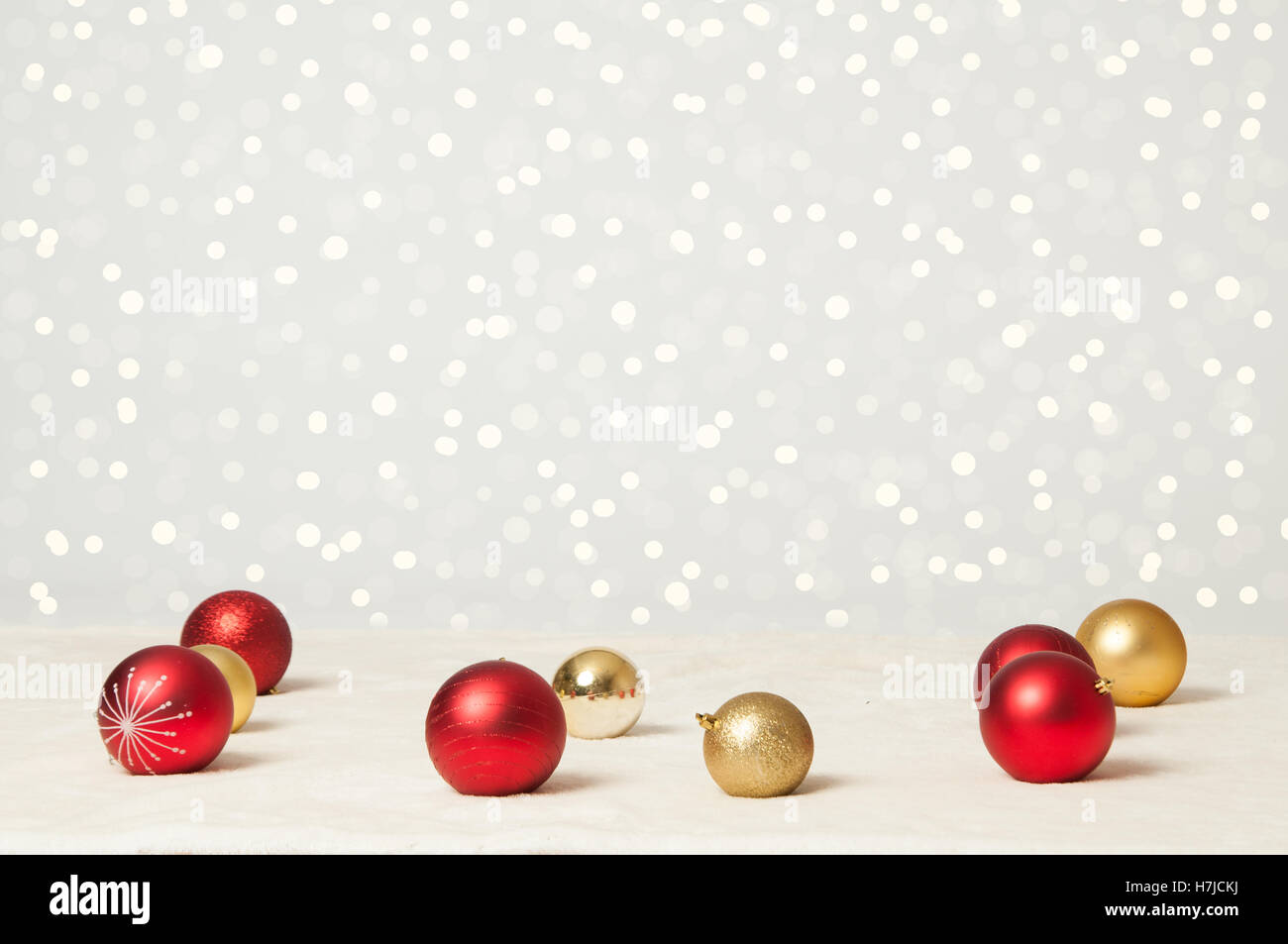 red and gold christmas balls and twinkle lights background Stock Photo