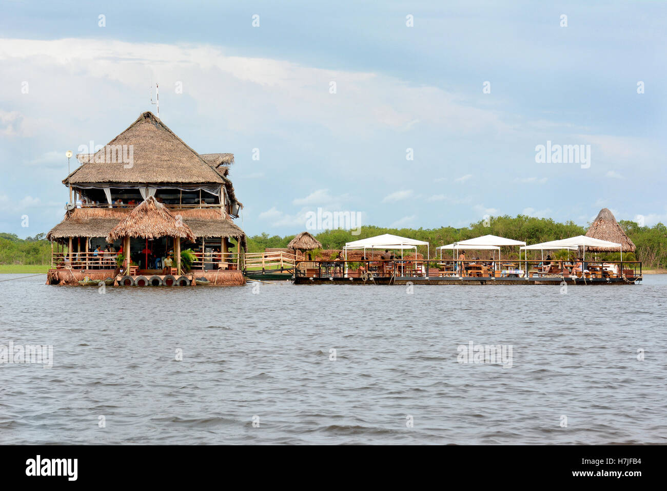 IQUITOS, PERU - OCTOBER 11, 2015: Al Frio y Al Fuego Restaurant. The floating restaurant on the Itaya River offers fine service Stock Photo