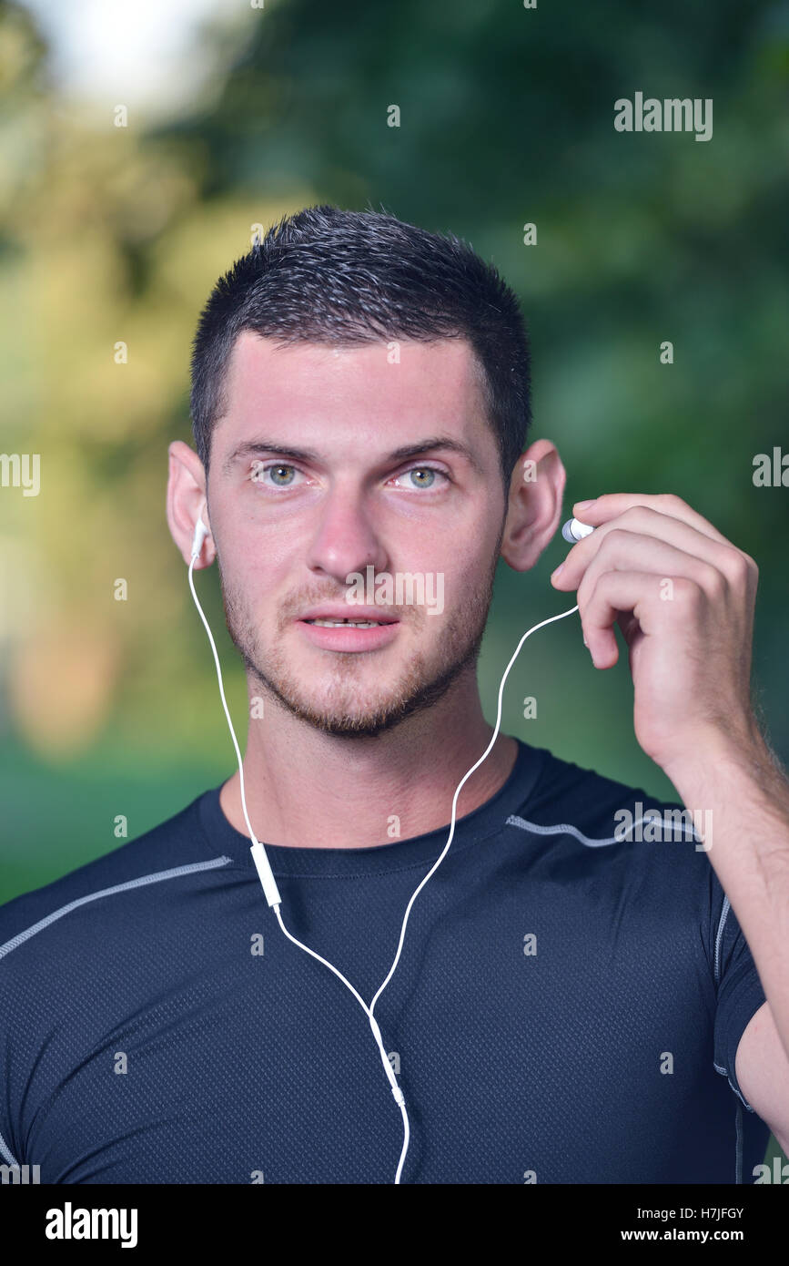 Sports and music. man getting ready for jogging Stock Photo Alamy