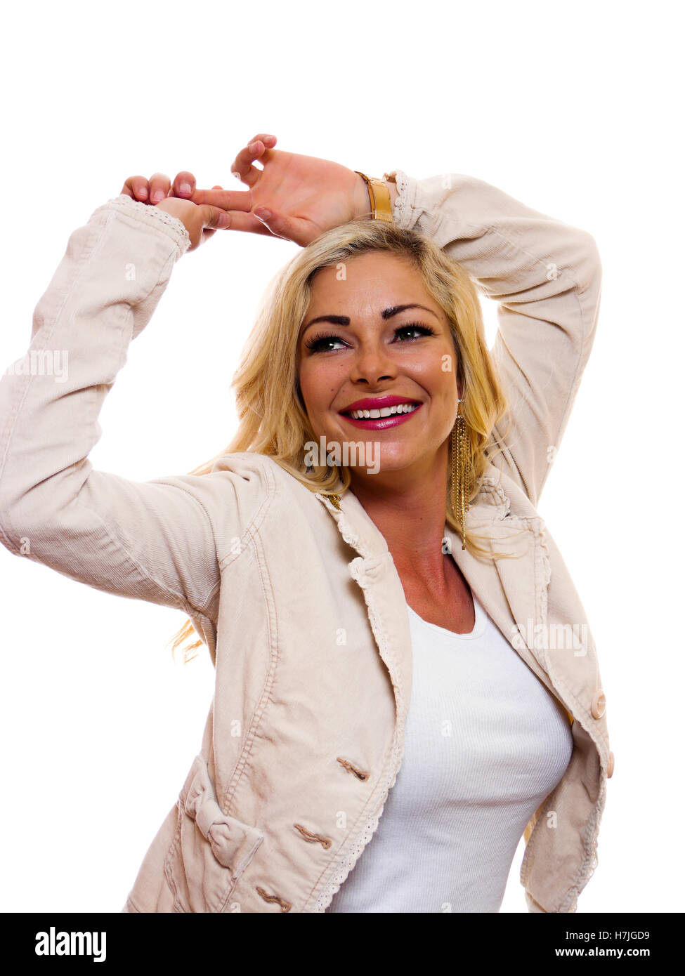 Image of a happy smiling woman with hands up over her head. Stock Photo