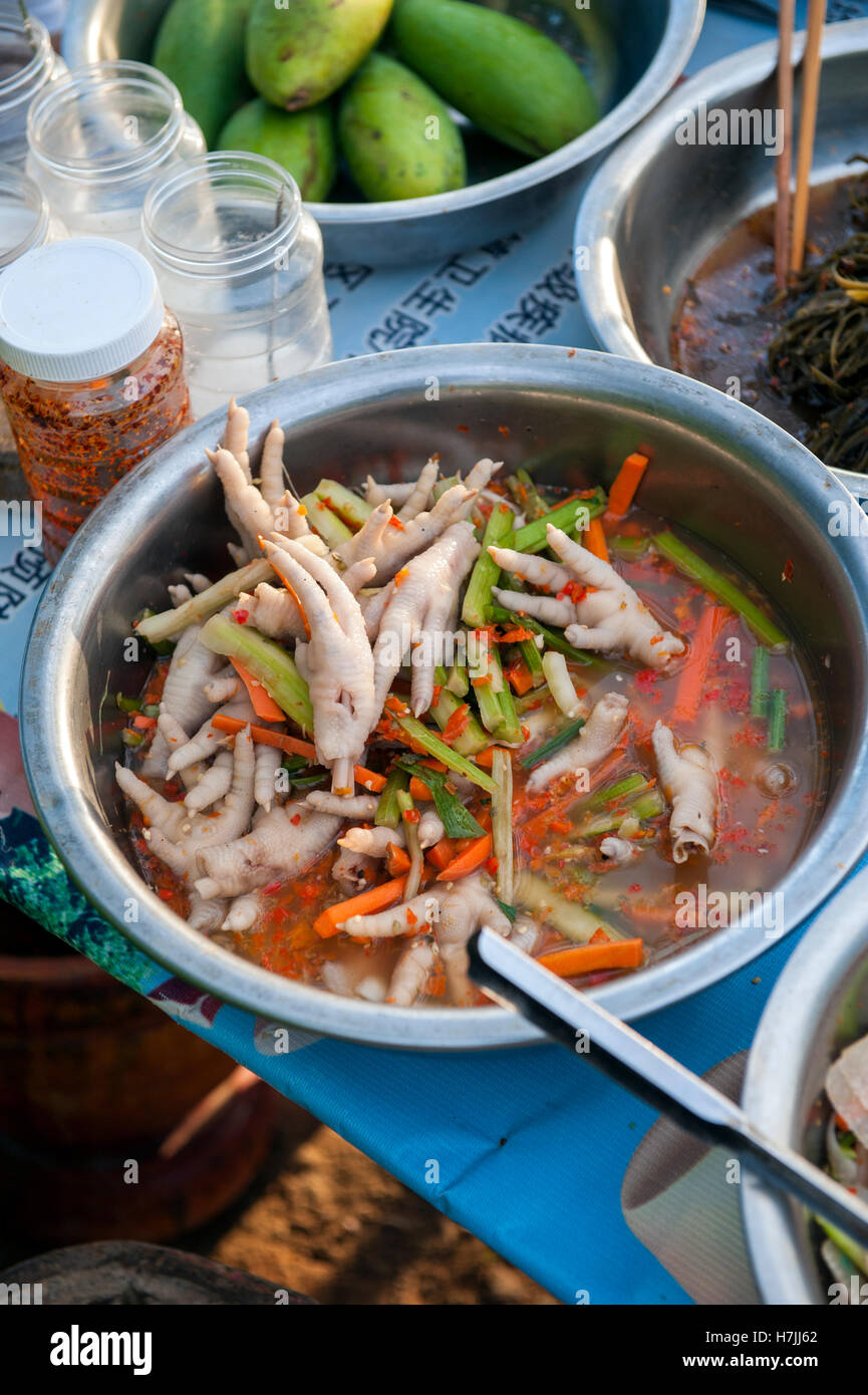 Marinated chicken feet for sale at a street food stall in the southern