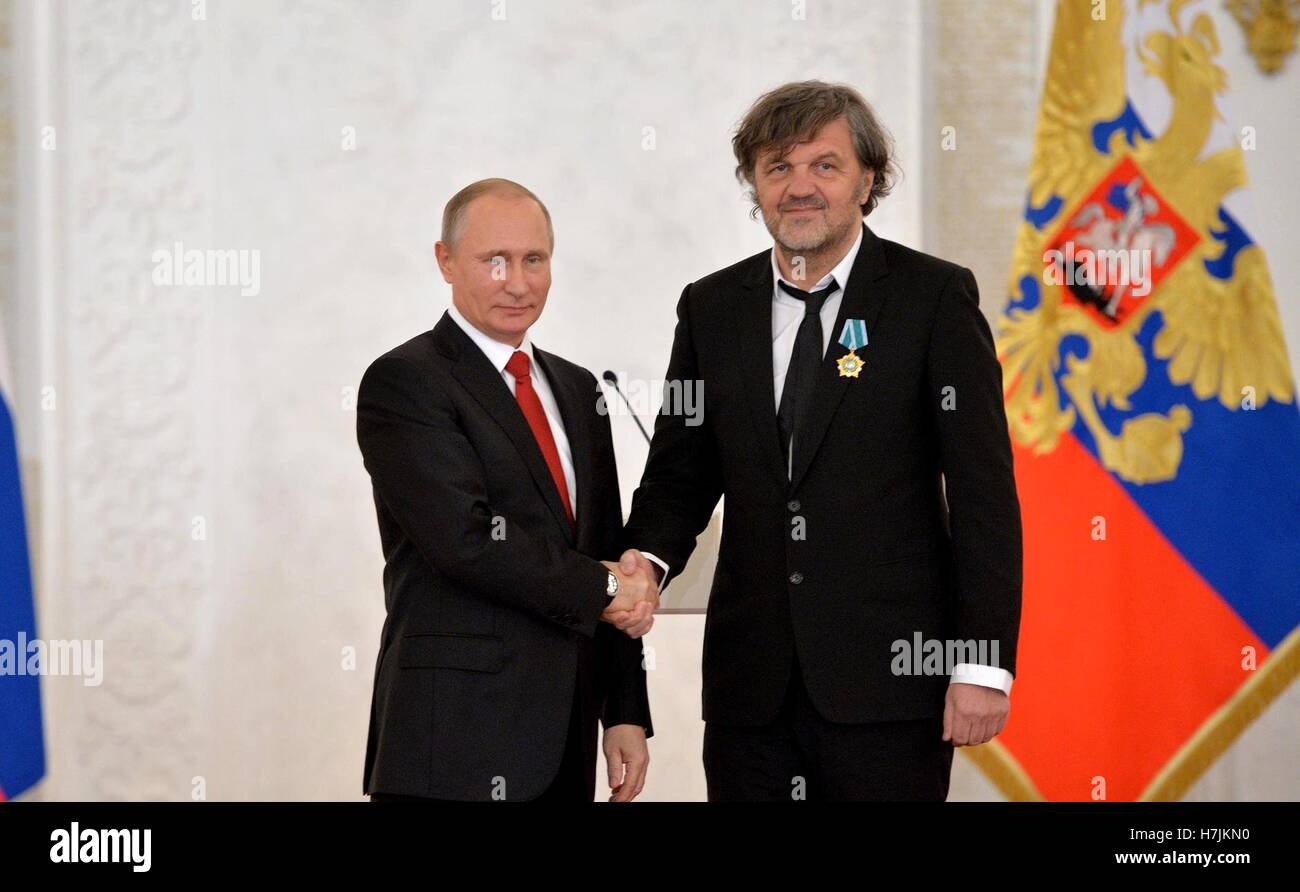 Russian President Vladimir Putin presents a medal to Serbian filmmaker, actor and musician Emir Kusturica during an award ceremony marking National Unity Day in the Kremlin November 4, 2016 in Moscow, Russia. Stock Photo