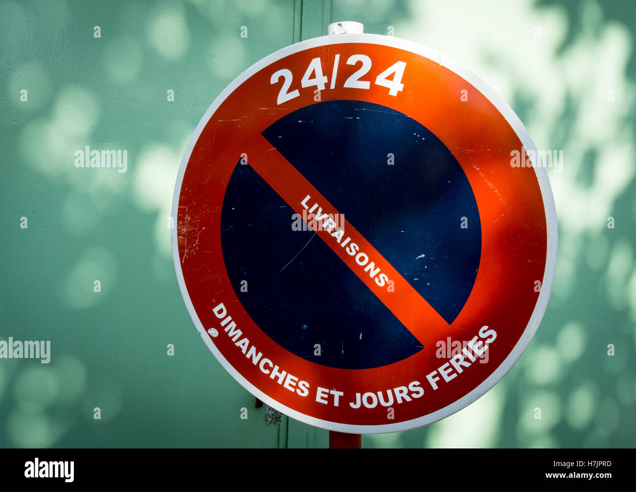 A French road sign forbidding deliveries on Sundays and public holidays Stock Photo