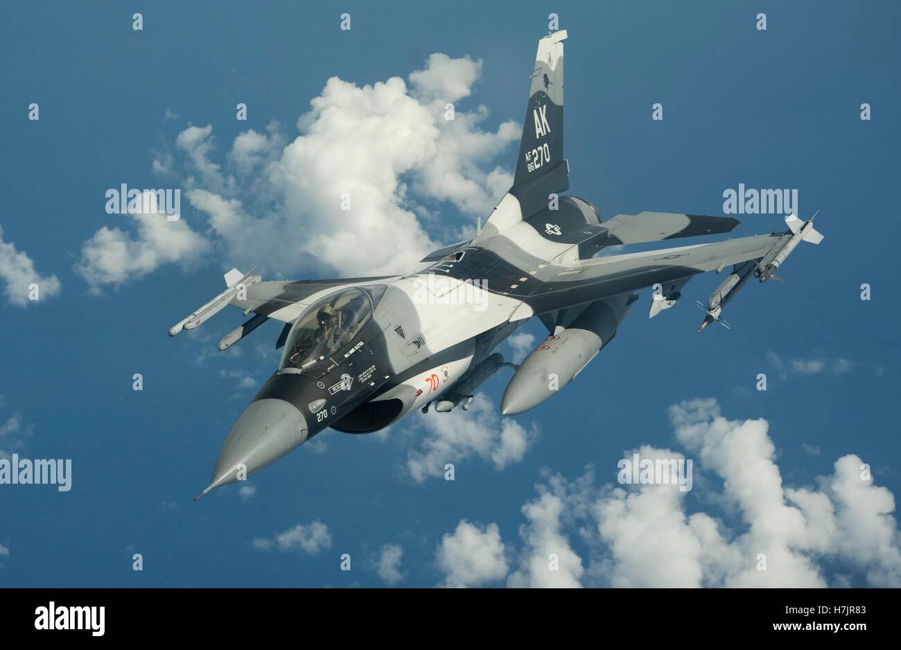 An F-16C Fighting Falcon fighter aircraft in flight during exercise Valiant Shield September 20, 2014 over Guam. Stock Photo