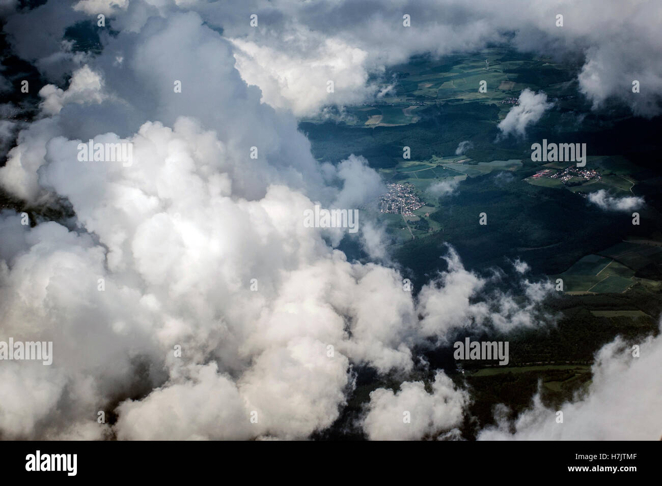 Aerial view Top cumulus clouds flying high over land Stock Photo - Alamy