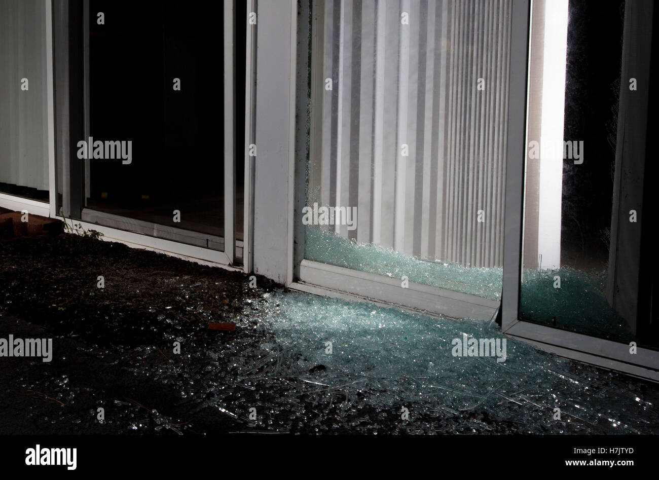 Shattered sliding glass door after an attempted home invasion Stock