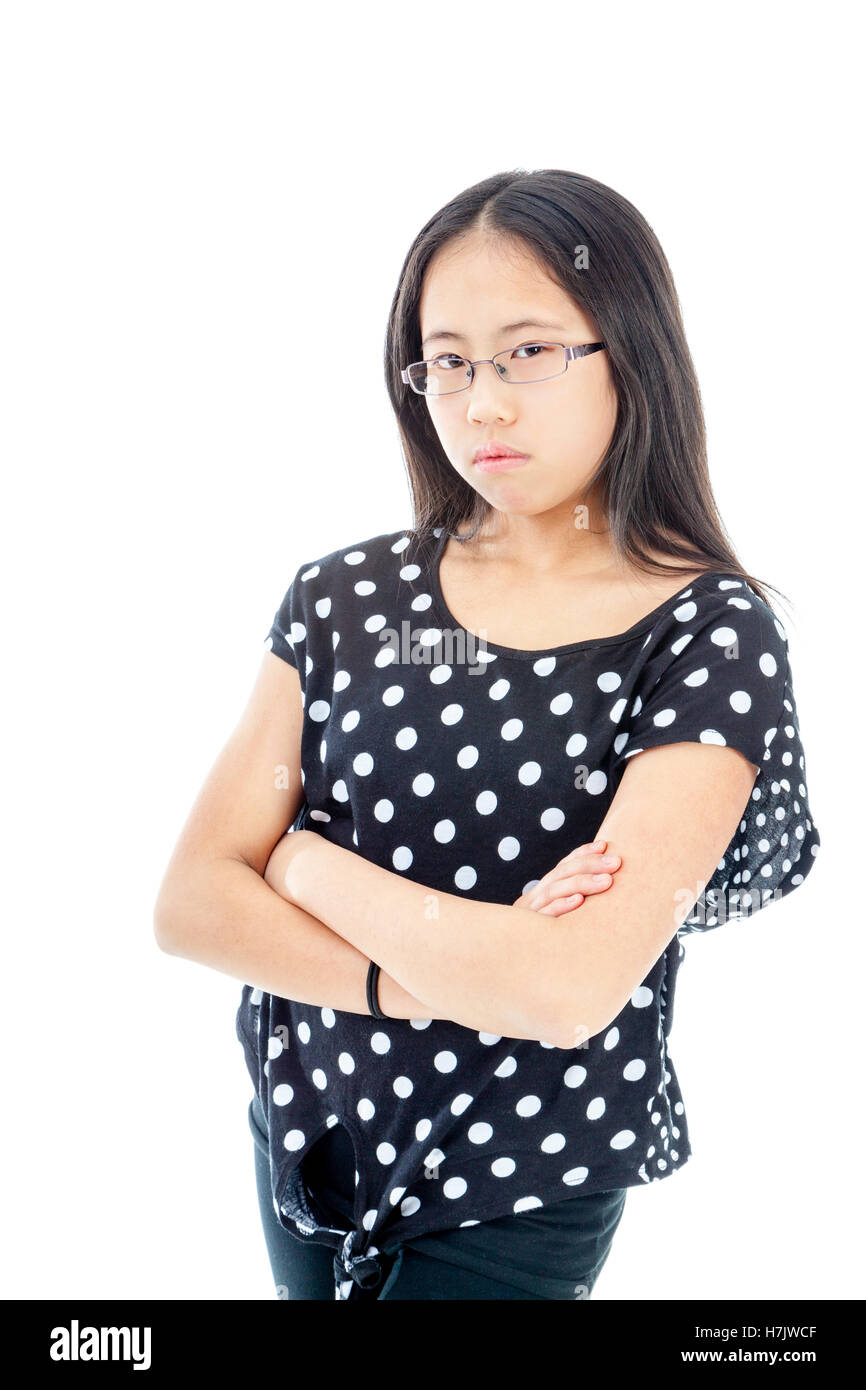 Asian tween girl with folded arms showing displeasure Stock Photo