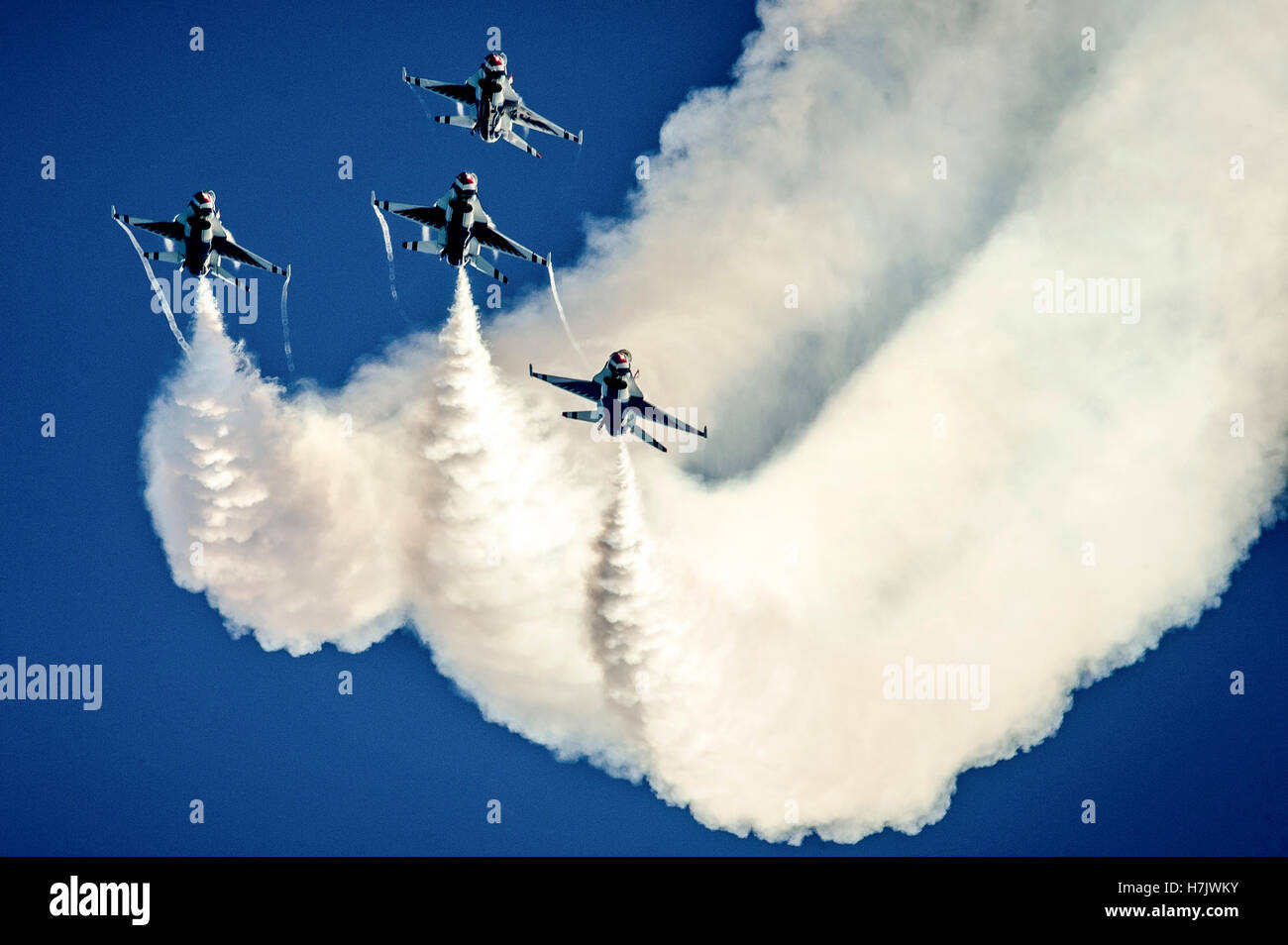 The Thunderbirds air demonstration aircraft perform an Arrowhead Loop aerial maneuver during the Wings and Waves Air Show October 12, 2014 in Daytona Beach, Florida. Stock Photo