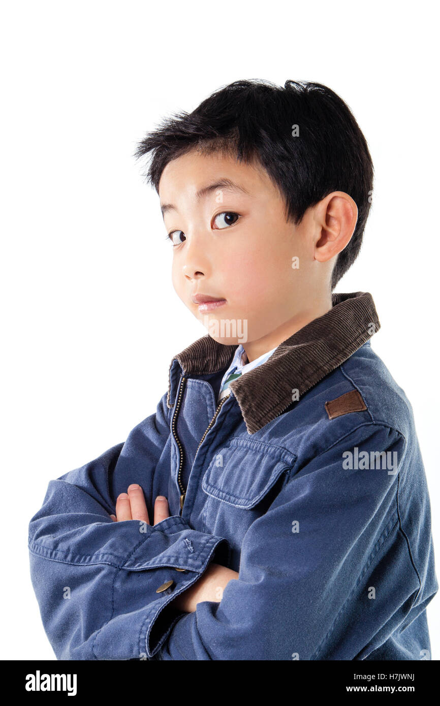 Asian boy in blue jacket staring at the camera. Stock Photo