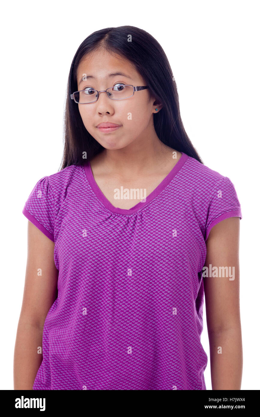 Studio portrait of an Asian teenage girl with eyes wide opened. Stock Photo