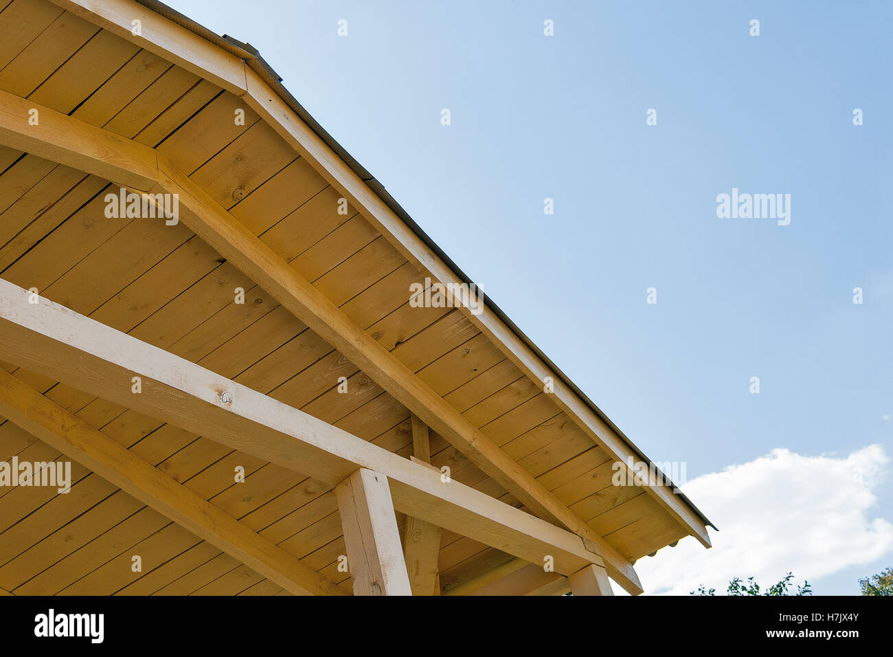 view of the construction of a pitched roof and sky Stock Photo