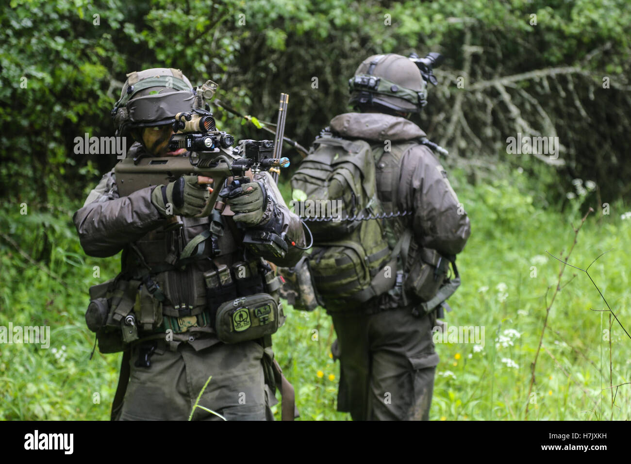 Austrian soldiers patrol during Combined Resolve II action training exercise at the Joint Multinational Readiness Center May 29, 2014 in Hohenfels, Germany. Stock Photo