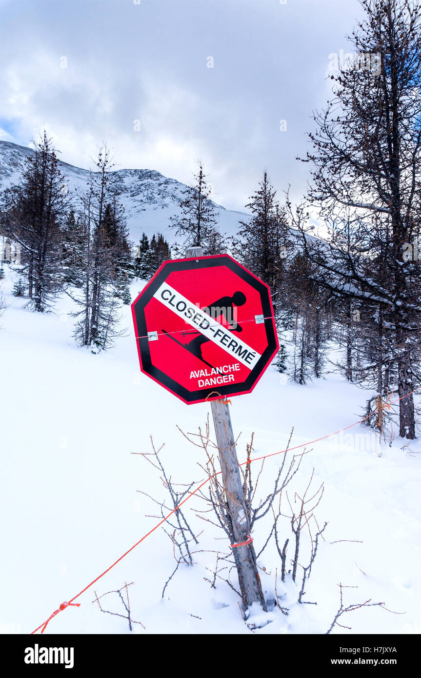 An avalanche warning sign at Lake Louis Ski Resort in Alberta, Canada Stock Photo