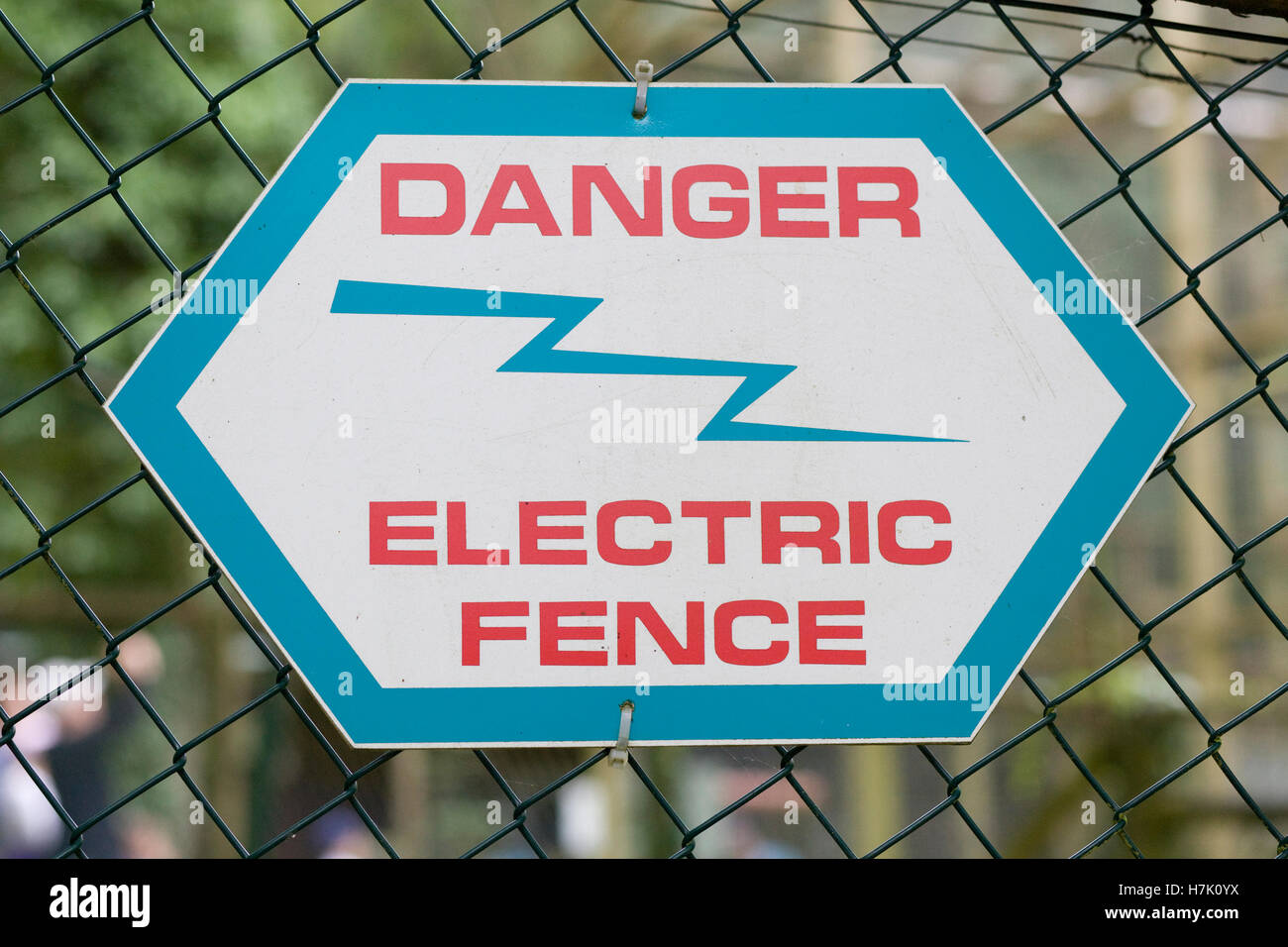 Danger electric fence sign on wire fencing Stock Photo - Alamy