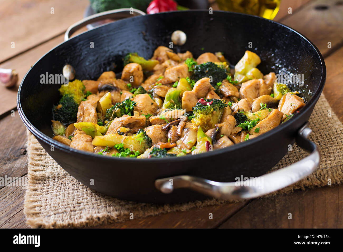 Stir fry chicken with broccoli and mushrooms Chinese food Stock Photo