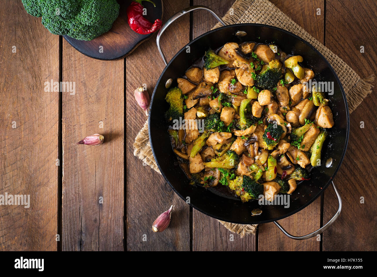 Stir fry chicken with broccoli and mushrooms Chinese food. Top view