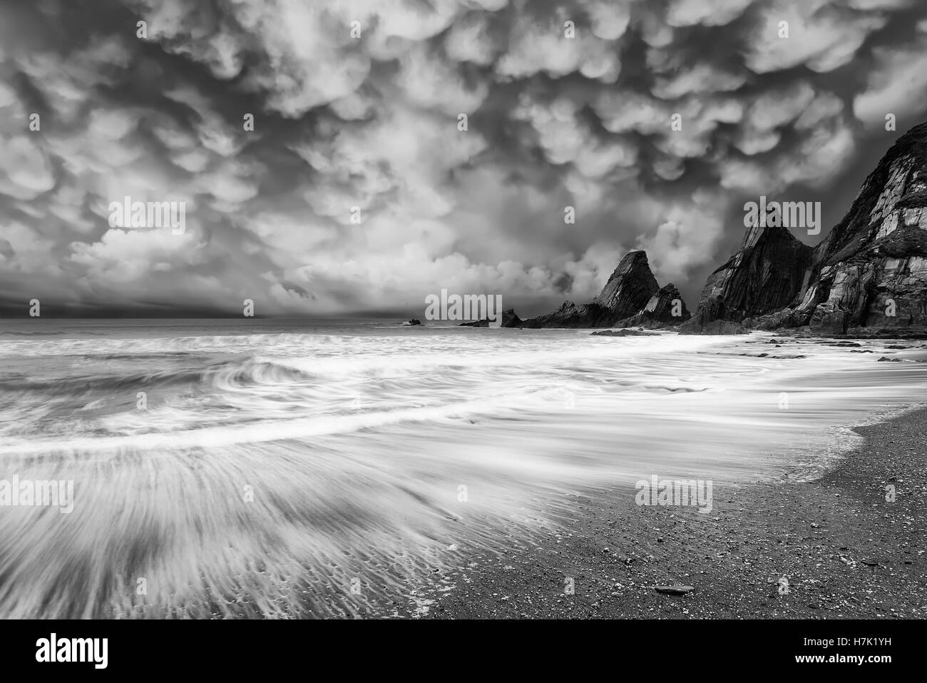 Beuatiful mammatus storm cloud formations over coastal landscape Stock Photo