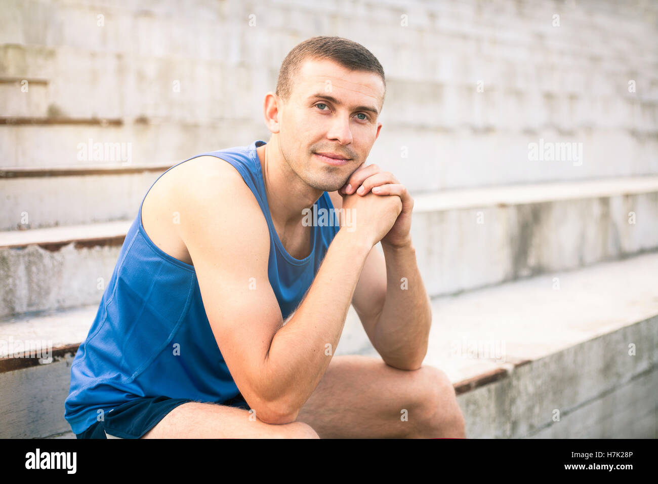 Portrait of a young man in a blue shirt closeup. Stock Photo
