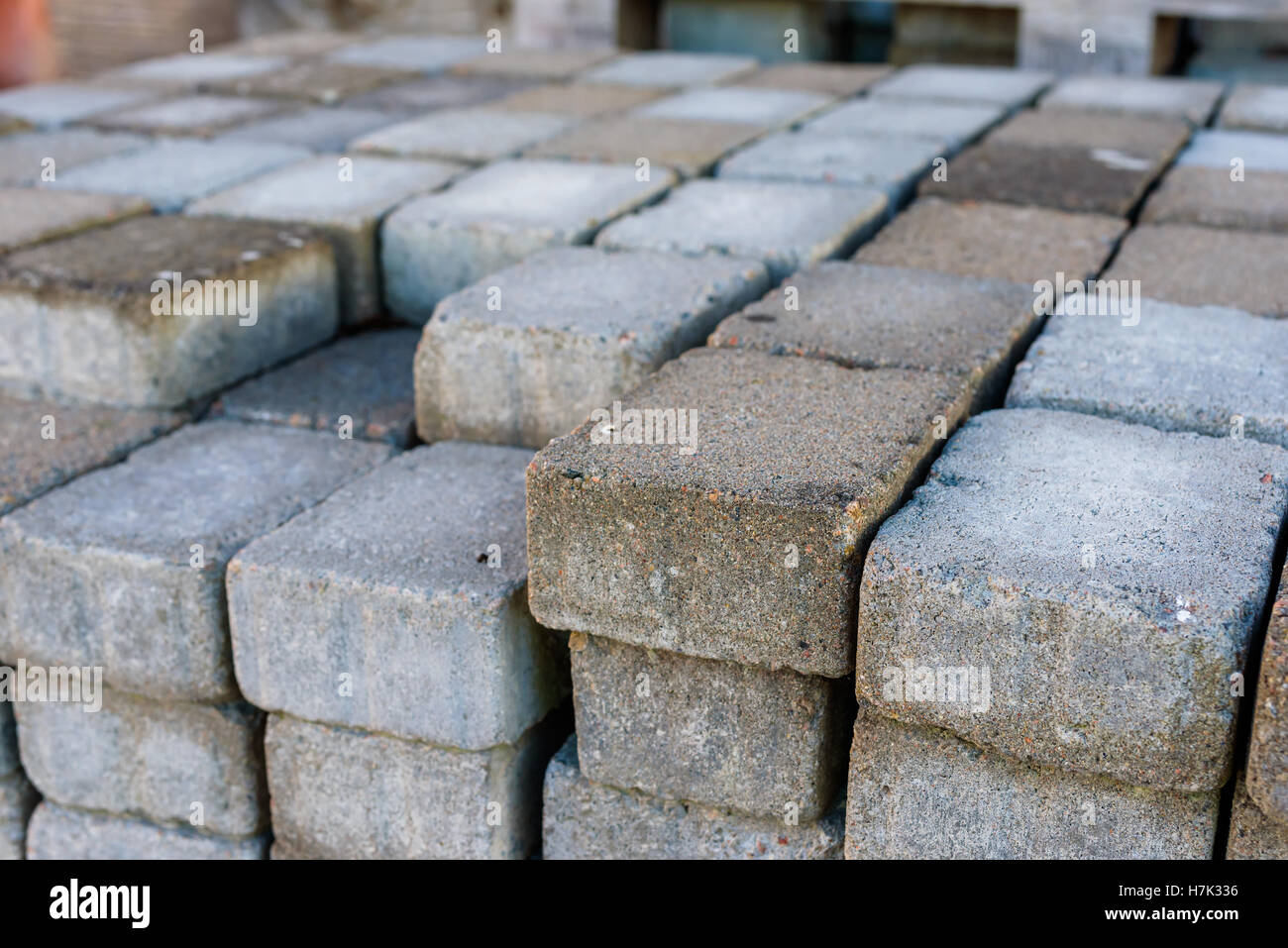 Stack of small rectangular concrete pavers. Stock Photo