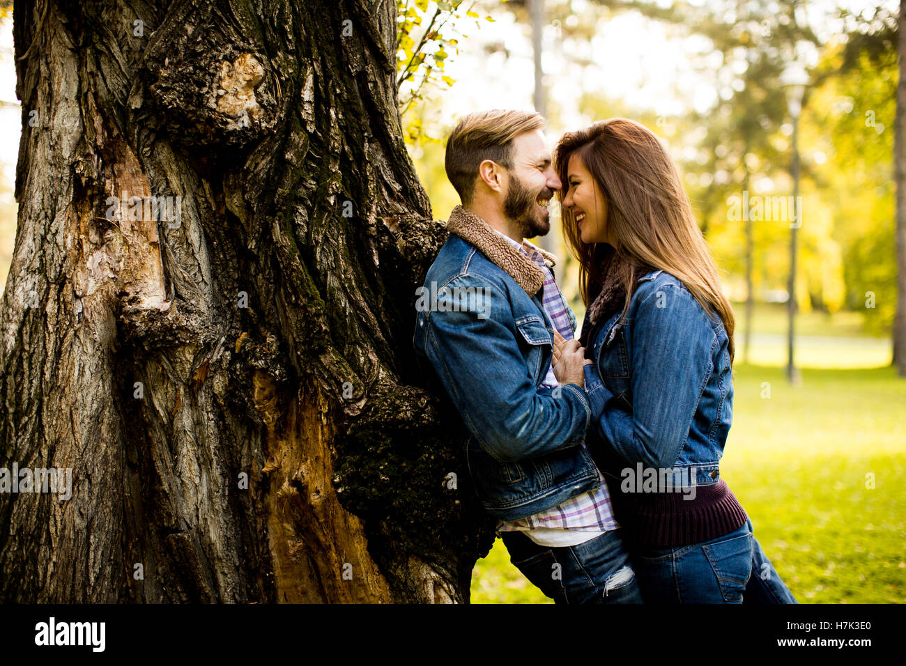 Loving young couple in the autumn park Stock Photo - Alamy