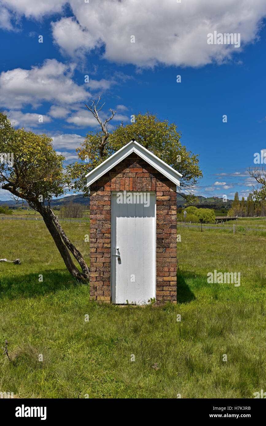 Australian brick outhouse toilet or dunny or thunderbox at small country rural town australian by Matheson Presbyterian Church Stock Photo