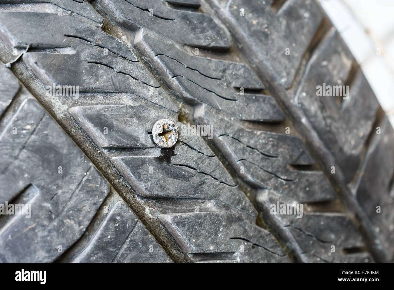 close up of screw nail puncturing damage tire Stock Photo Alamy