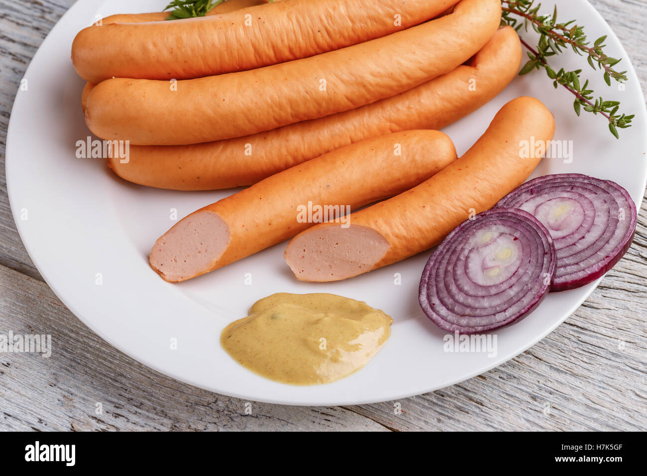 Hot Dog sausages on white plate Stock Photo