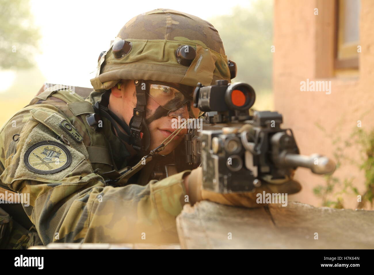 A Czech soldier looks through his gun sight during exercise Allied Spirit II simulated town assault training at the U.S. Army Joint Multinational Readiness Center August 14, 2015 in Hohenfels, Germany. Stock Photo