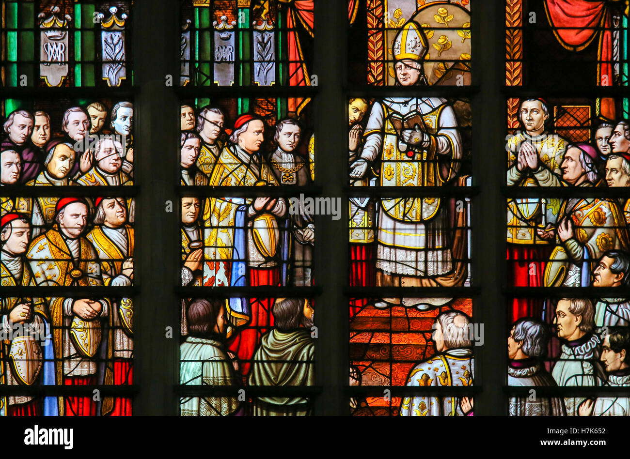 Stained Glass in Mechelen Cathedral of the promulgation of the papal bull Ineffabilis Deus, defining the dogma of the Immaculate Stock Photo