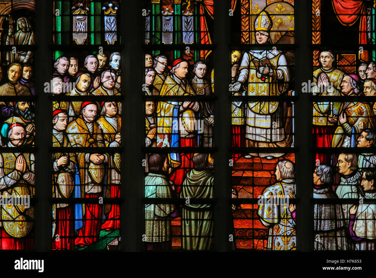 Stained Glass in Mechelen Cathedral of the promulgation of the papal bull Ineffabilis Deus, defining the dogma of the Immaculate Stock Photo