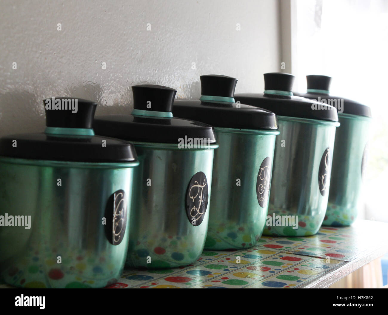 Set Of Anodised Coloured Antique Kitchen Canisters Stock Photo