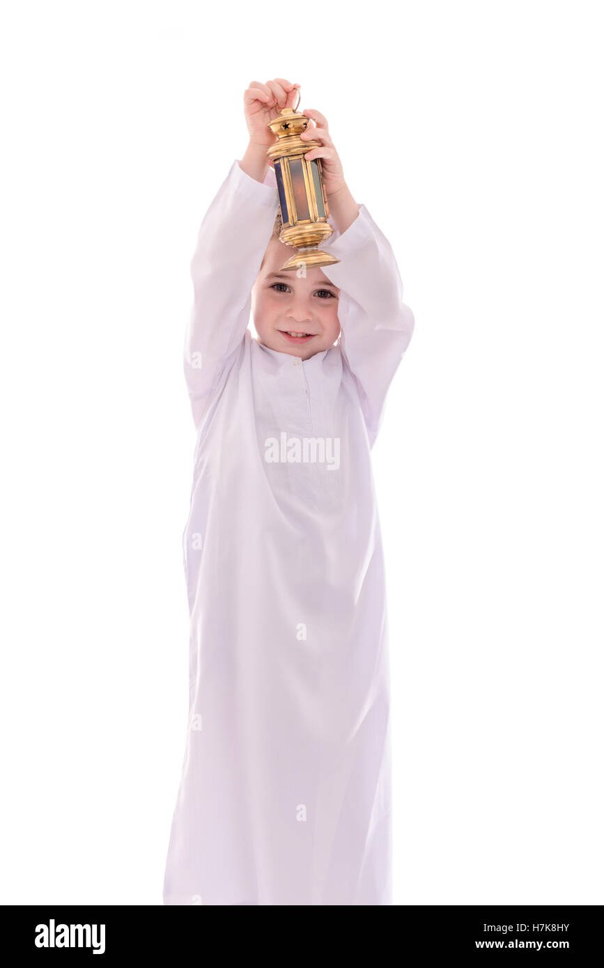 Happy Young Muslim Boy With Ramadan Lantern Isolated on White Background Stock Photo