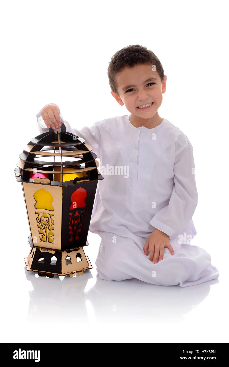 Happy Young Boy with Big Fanoos Celebrating Ramadan Isolated on White Background Stock Photo
