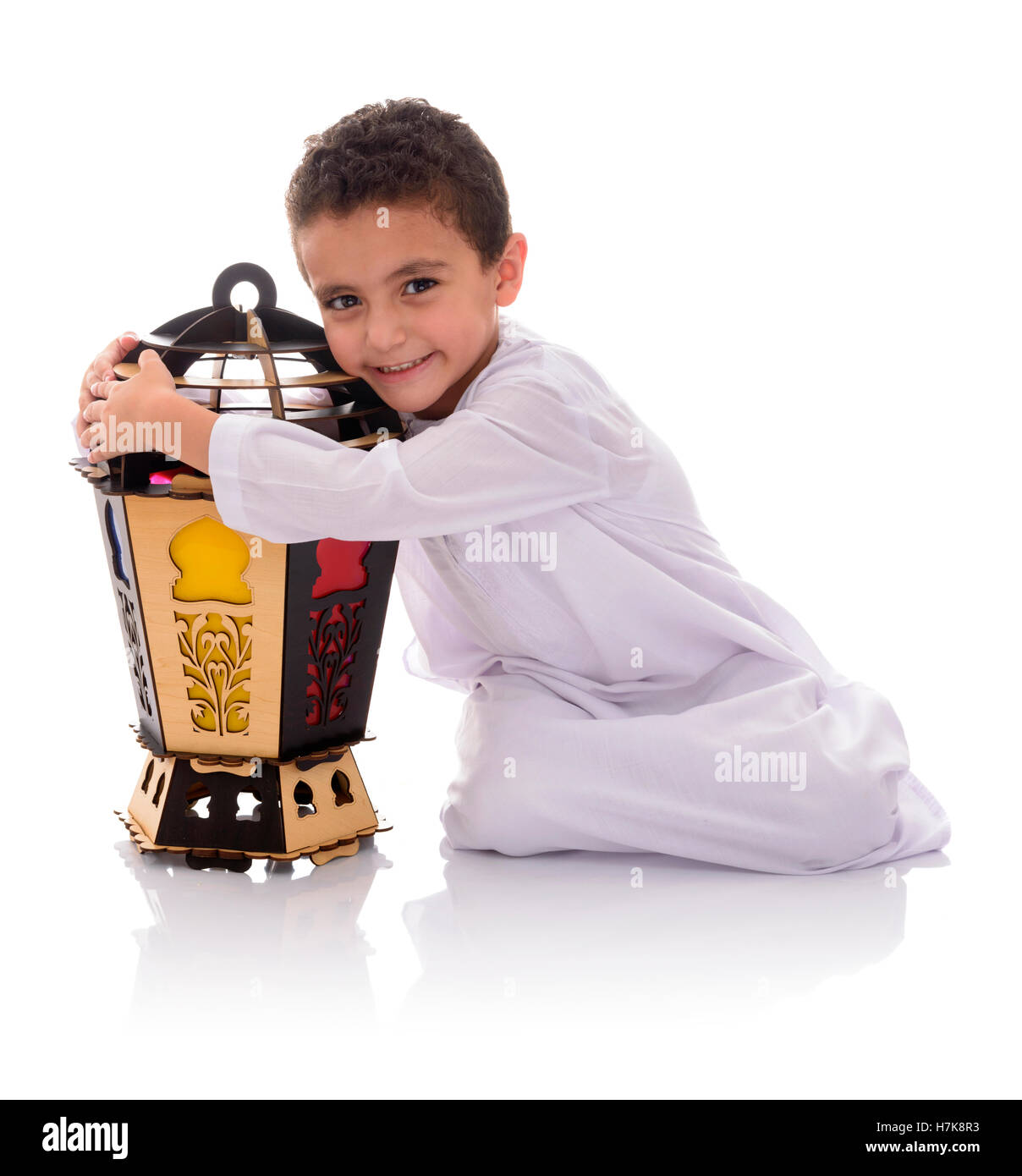 Happy Young Boy Hugging Ramadan Lantern Isolated on White Background Stock Photo