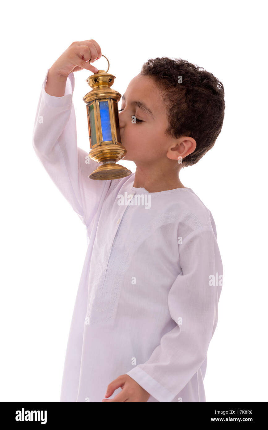 Little Young Boy Kissing Ramadan Lantern Isolated on White Background Stock Photo
