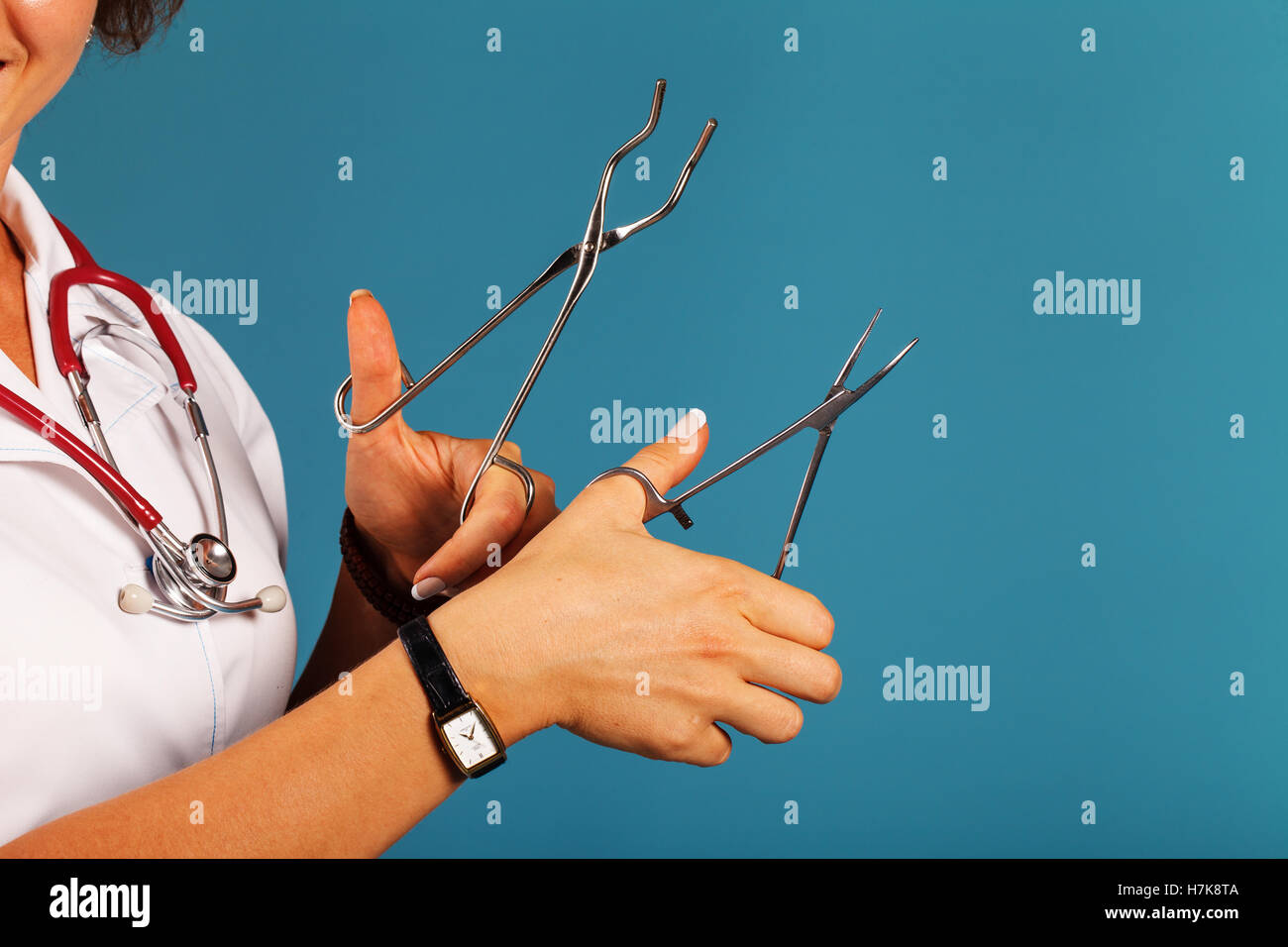 a doctor with a medical instrument in the hands Stock Photo - Alamy