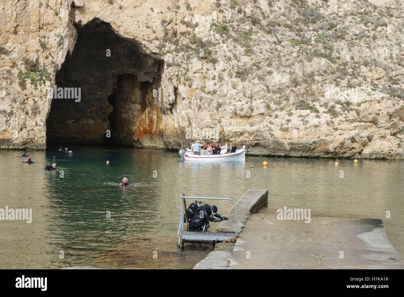 Gozo, Dwejra bay. The Inland Sea. Boat trip to view the Azure Window, through cave access to lagoon. Scuba diver. Stock Photo
