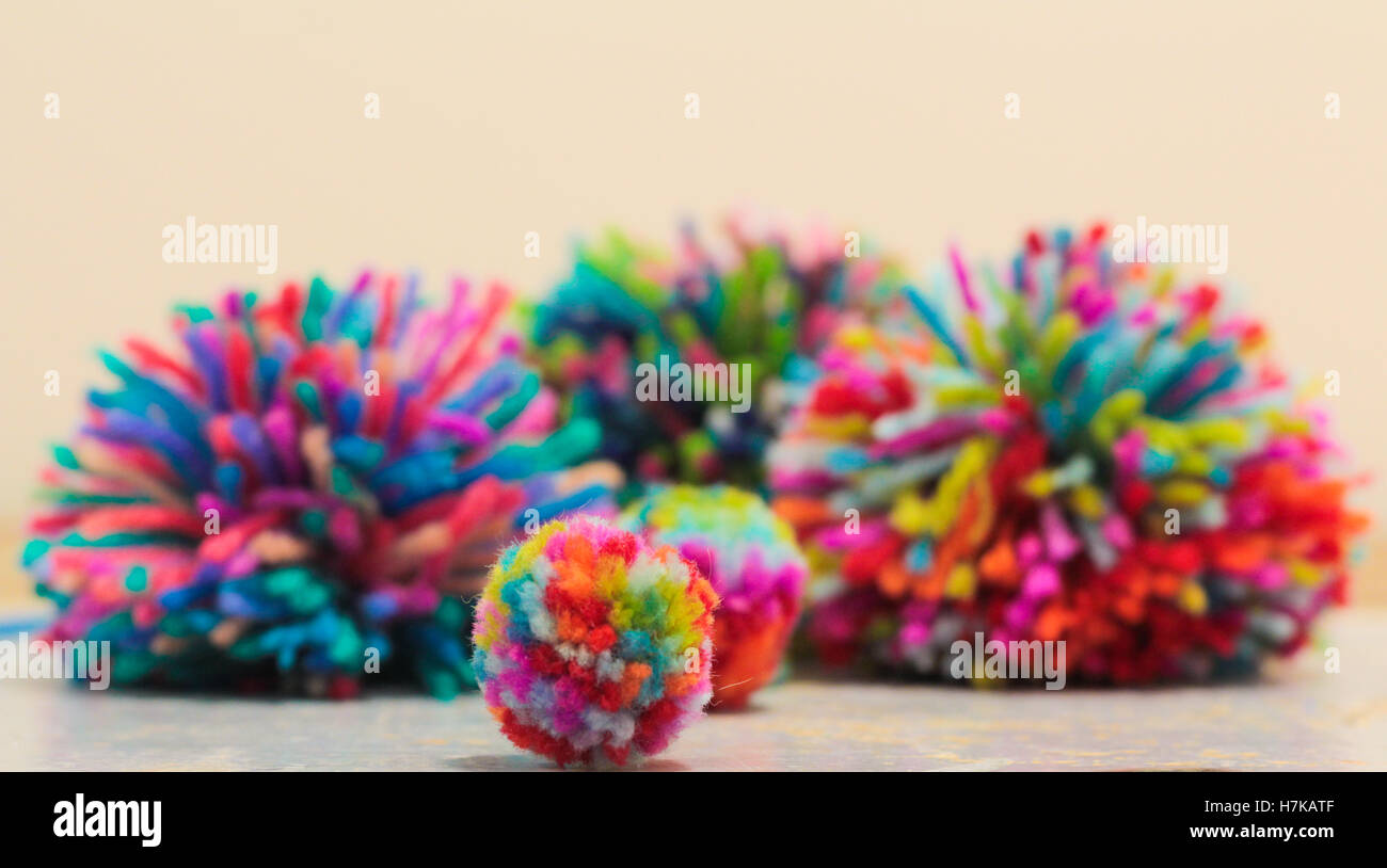 Colourful handmade pom poms Stock Photo