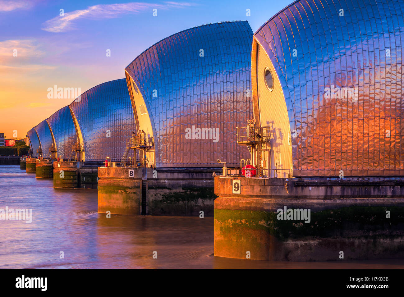 Thames Barrier, located downstream of central London at sunset Stock Photo