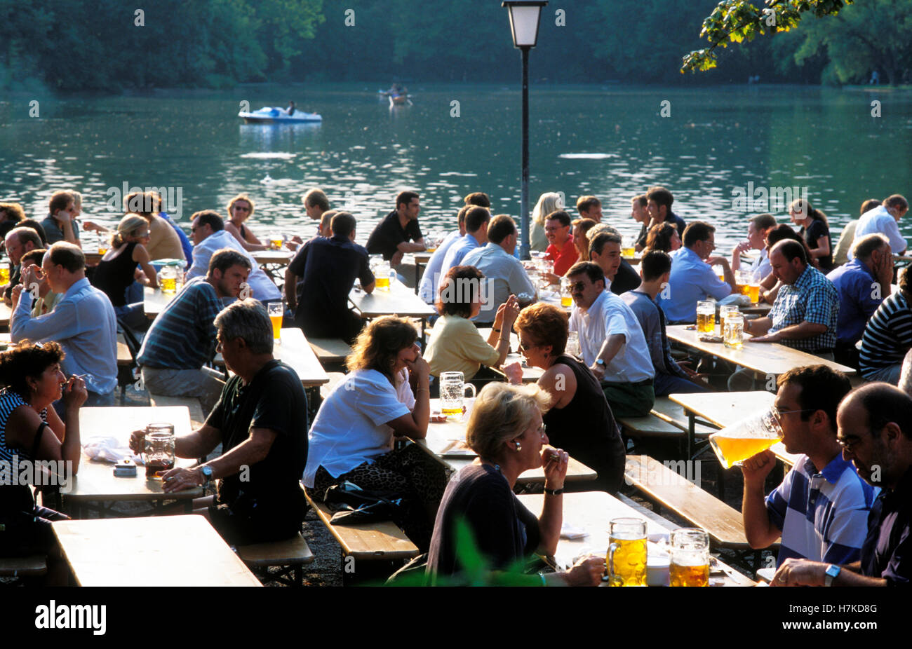 Seehaus beer garden on the Kleinhesseloher See lake, people drinking beer, English Garden, Munich, Bavaria Stock Photo
