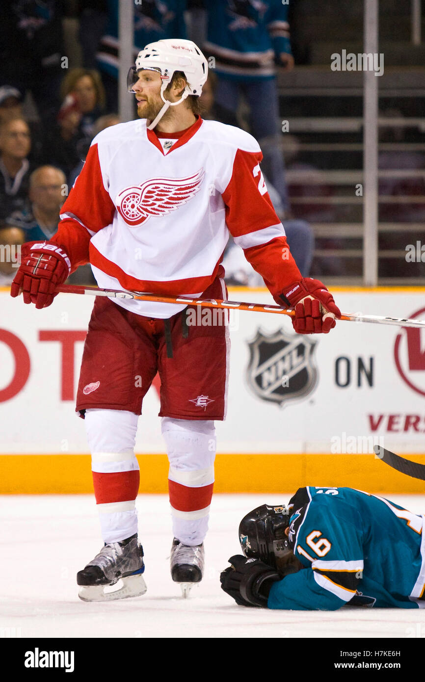 April 29, 2010; San Jose, CA, USA;  Detroit Red Wings defenseman Brad Stuart (23) stands over San Jose Sharks right wing Devin Setoguchi (16) after hitting him with his stick during the second period of game one of the western conference semifinals of the 2010 Stanley Cup Playoffs at HP Pavilion. San Jose defeated Detroit 4-3. Stock Photo