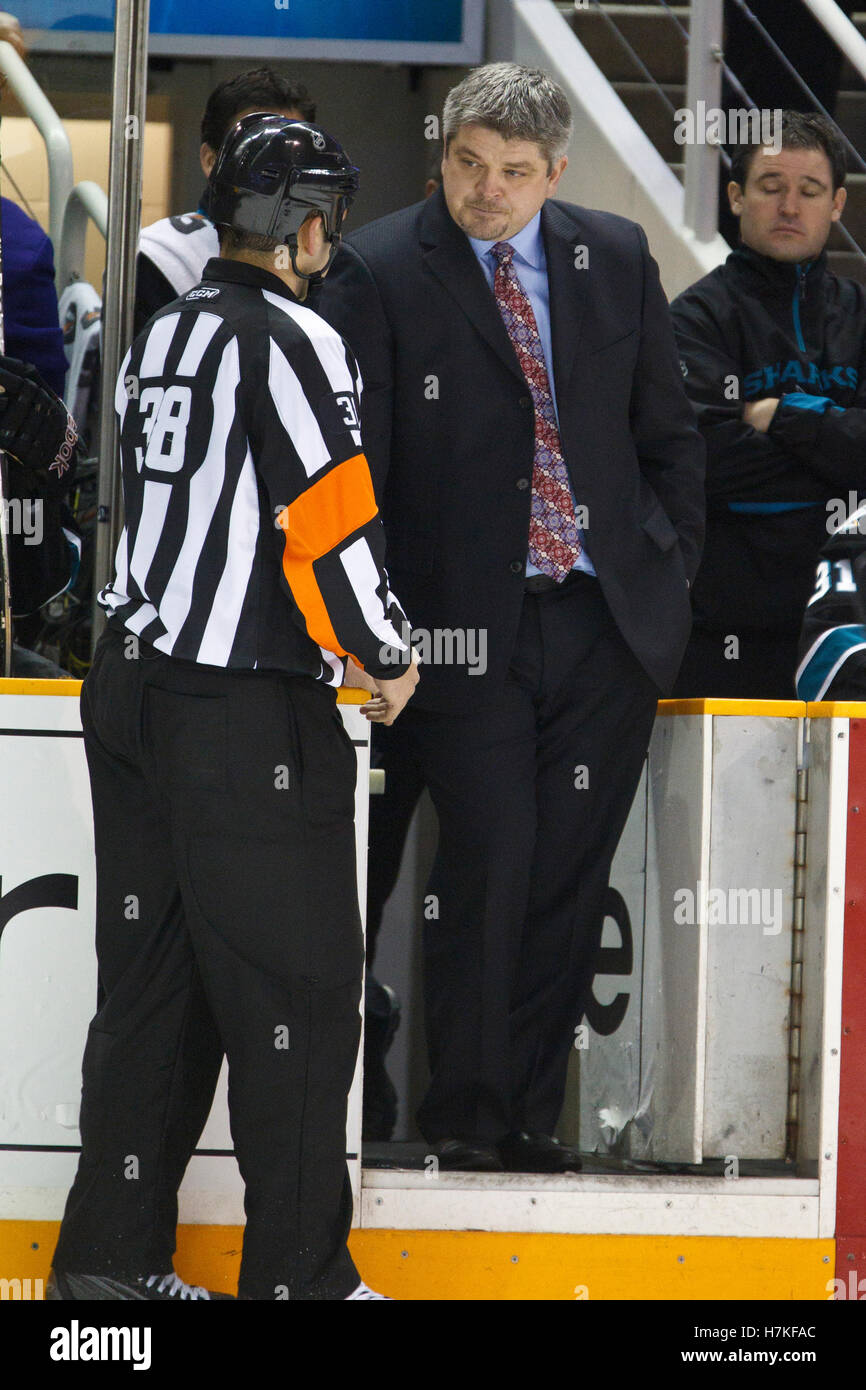 January 13, 2011; San Jose, CA, USA; San Jose Sharks head coach Todd McLellan argues a call with referee Francois St. Laurent (38)during the third period against the Edmonton Oilers at HP Pavilion.  Edmonton defeated San Jose 5-2. Stock Photo