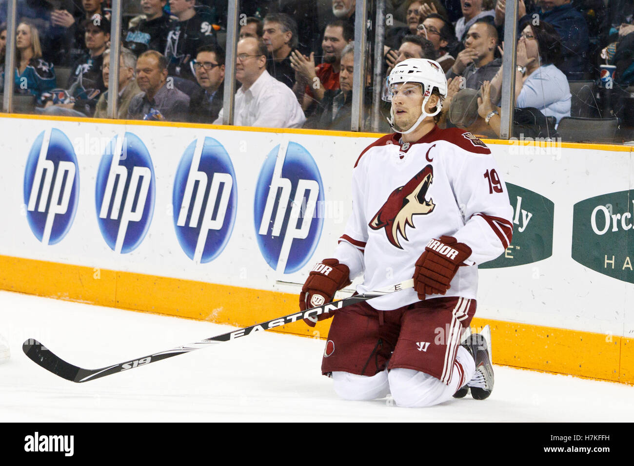 February 1, 2011; San Jose, CA, USA; Phoenix Coyotes right wing Shane Doan (19) is knocked to the ice against the San Jose Sharks during the third period at HP Pavilion. San Jose defeated Phoenix 5-3. Stock Photo